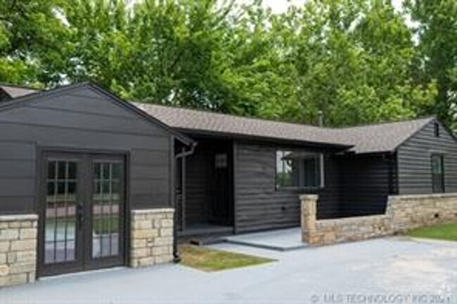 Building Photo - This beautifully updated 1950s home underw...