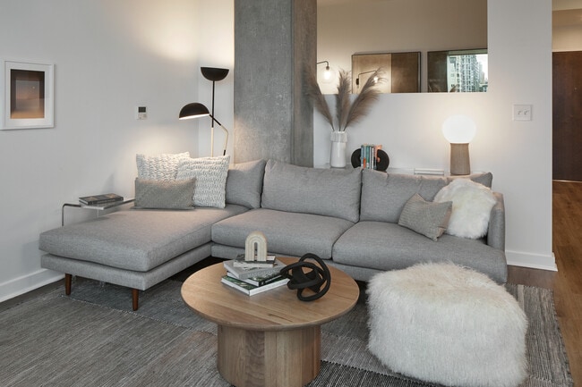 Apartment living room with wood-style flooring.