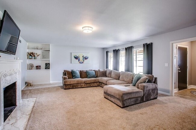 Photo - Spacious 4-Bedroom Home with Dual Living Areas