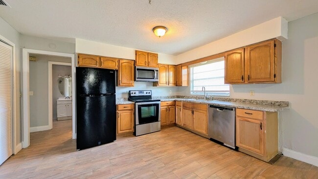 Photo - 2 bedroom 2 bath with an updated kitchen, bathrooms, and tile flooring throughout.