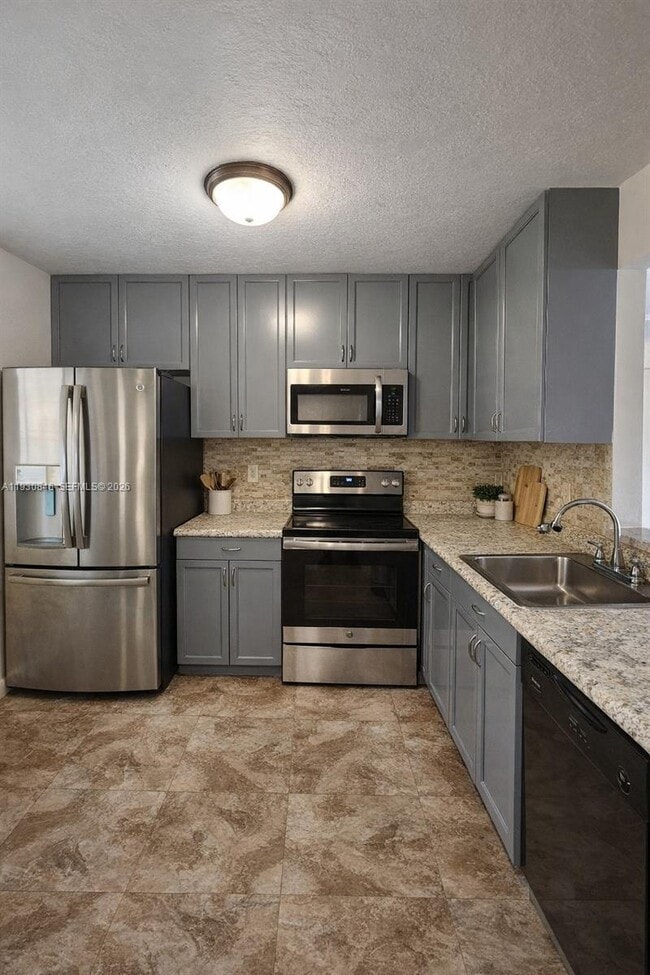 Building Photo - 8620 N Sherman Cir Unit 406