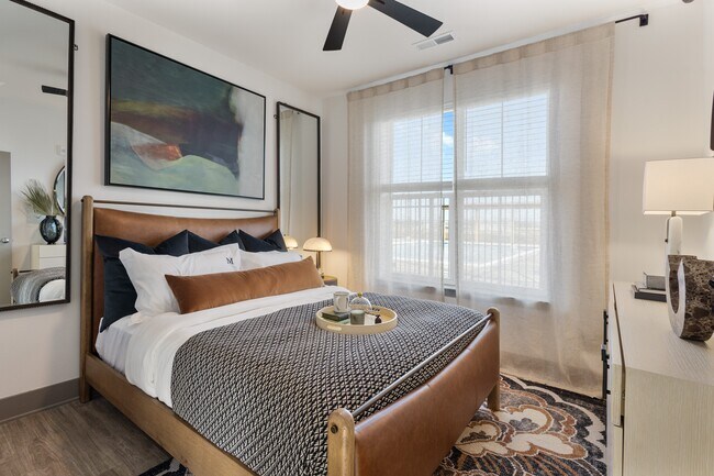 Model apartment bedroom with modern finishes at Montage West Lafayette.