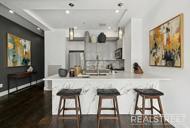 Photo - Modern Bushwick 2-bedroom, 2.5-bath duplex with private garden, deck, and finished recreation room —