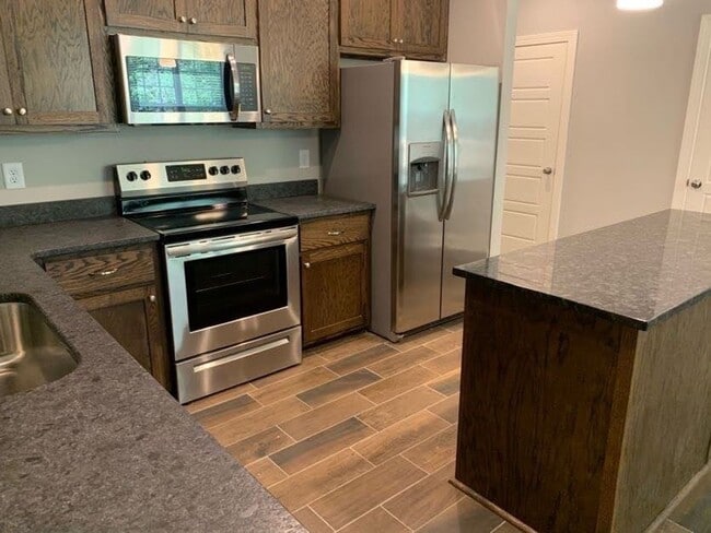 Photo - Convenient 3BR/2BA Townhome with Garage & Lawn Care Included