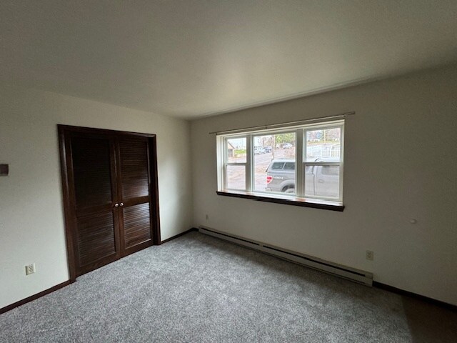 Living room and entry to BR 2 - 930 Elm St Unit 1