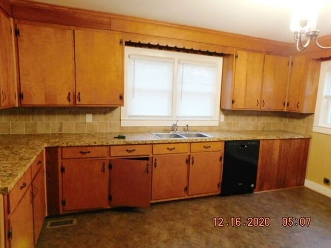 Photo - Home with 2 bedrooms, 1 bath, side deck, carport with side porch and detached garage