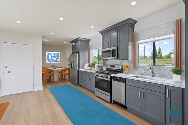 Open-Concept Kitchen with Dining Area - Penmar Superba by Wiseman