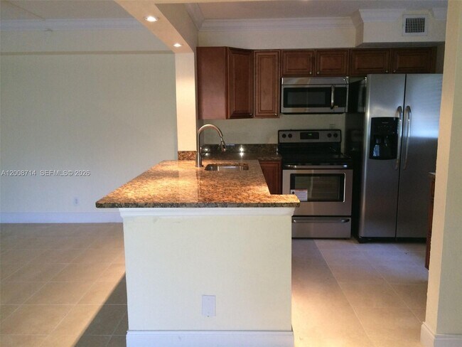 Building Photo - 407 Gardens Dr Unit 103