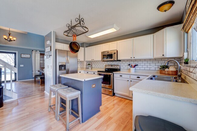 Photo - Evolve Real Estate: Available 06/03/2026 Beautiful 3 Bedroom + Loft + Finished Basement in the Po...