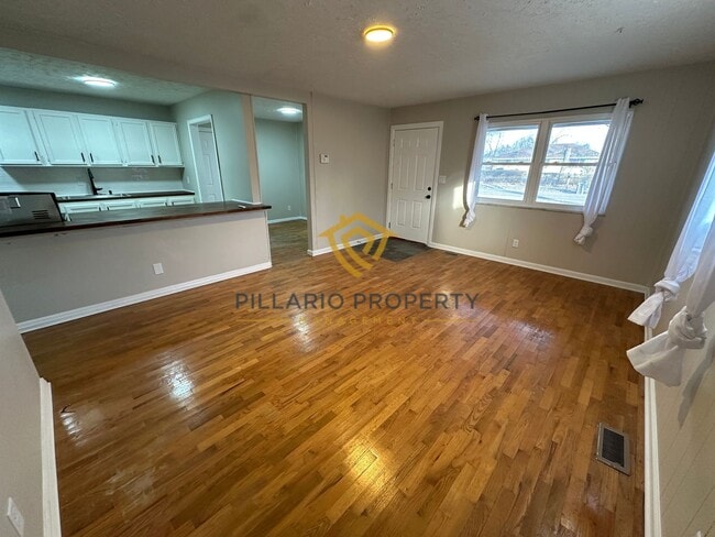 Photo - Spacious 4 Bedroom Home Featuring Open Layout & Hardwood Floors Available NOW!