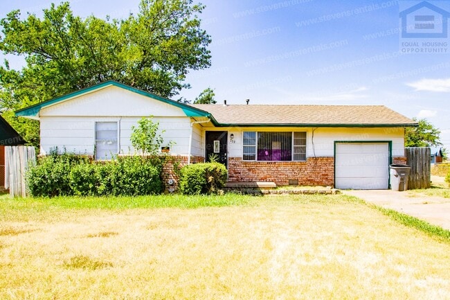 707 SW 49th St
