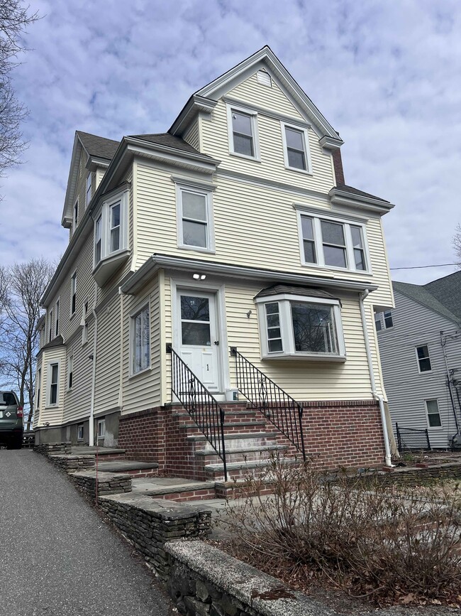 Front of home with shared patio - 61 Wollaston Ave Unit 61 Wollaston Ave -  2