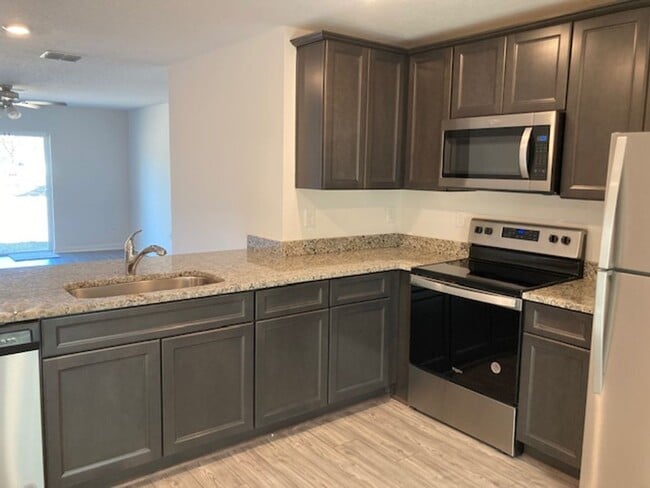 Photo - Like New 3/2/2 house with a screened in porch.