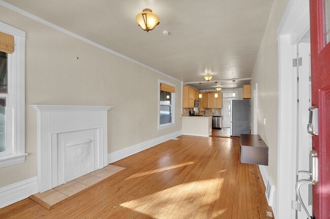 Photo - $2,100 - 2 bed, 1 Bath Townhome in Denver with AC, In Unit Laundry, and Yard!