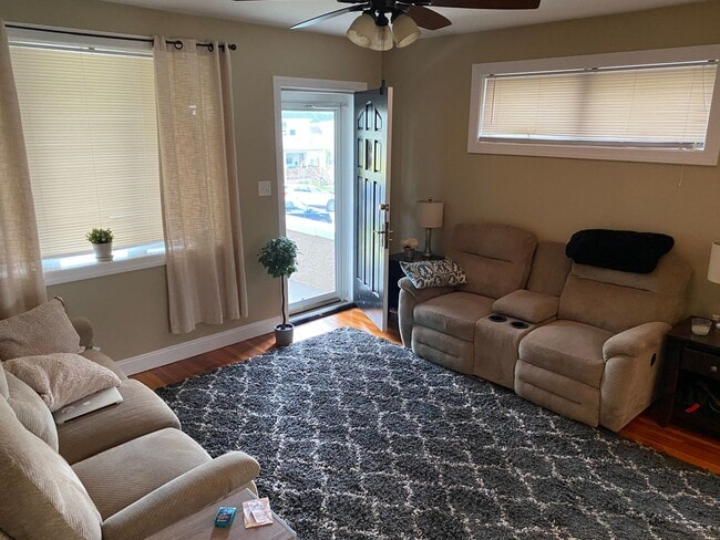 Photo - 3BR Twin Home | Hardwood Floors • Fenced Yard • Garage • W/D Included