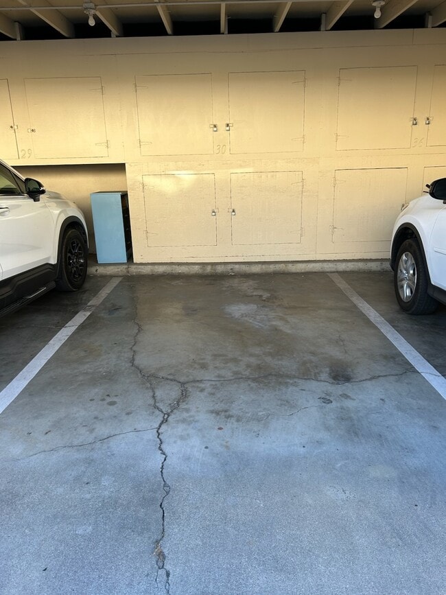 covered parking space with storage cupboards - 138 S Bryn Mawr St Unit 30