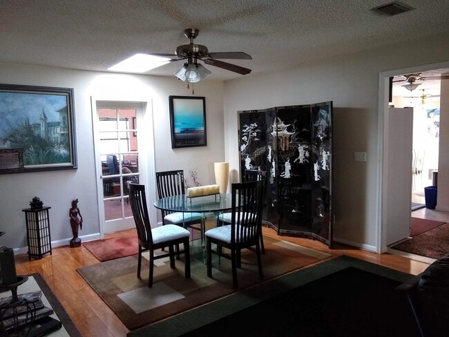 Dining room with entry doors to dining room and kitchen - 2620 Moody Ave