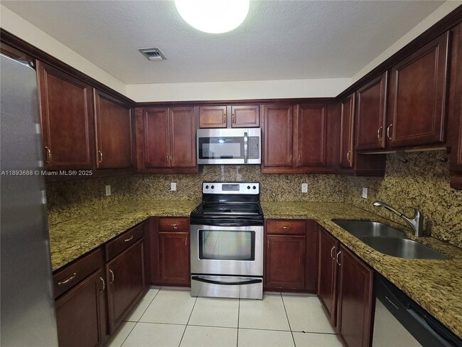 Building Photo - 5271 SW 8th St Unit 411