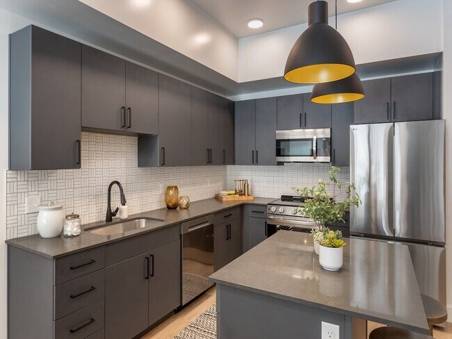 Kitchen with Dark Accents - Maye House Apartments