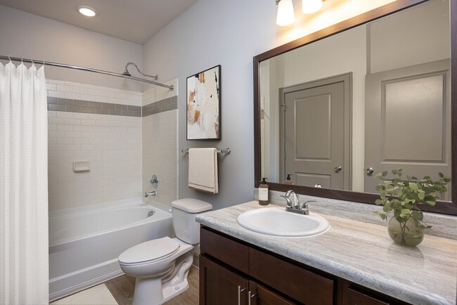 Bath with hard-surface vinyl plank flooring