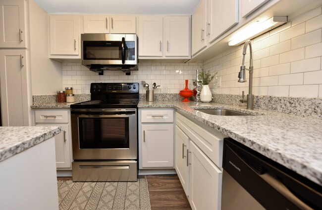 Kitchen + Granite Counters - Hudson on the Greenway Apartments