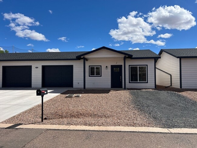 Building Photo - Dual Primary Suites & 2 car Garage Unit 2