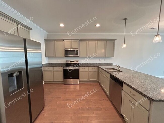 Photo - Spacious 3 Bed, 2.5 Bath Home with Modern Amenities / Available Soon!