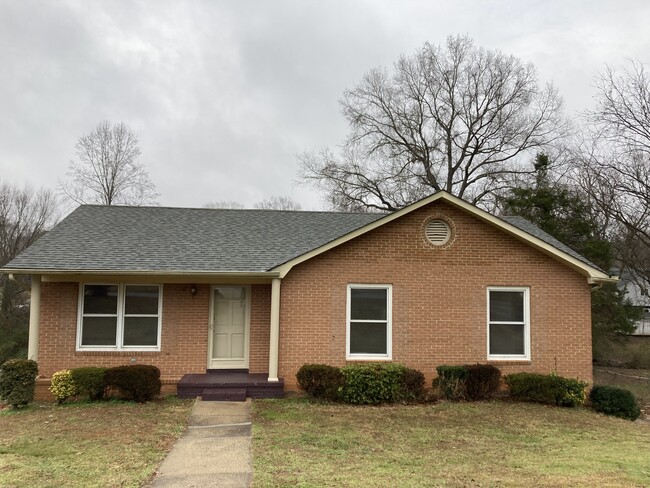 Beautiful brick home with a surprising amount of living space inside. - 5200 Peppercorn St House