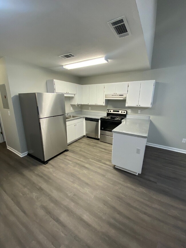 Freshly Remodeled 2 BR 2 BA Townhome Available Now! Beautiful New Flooring, Paint, And More!