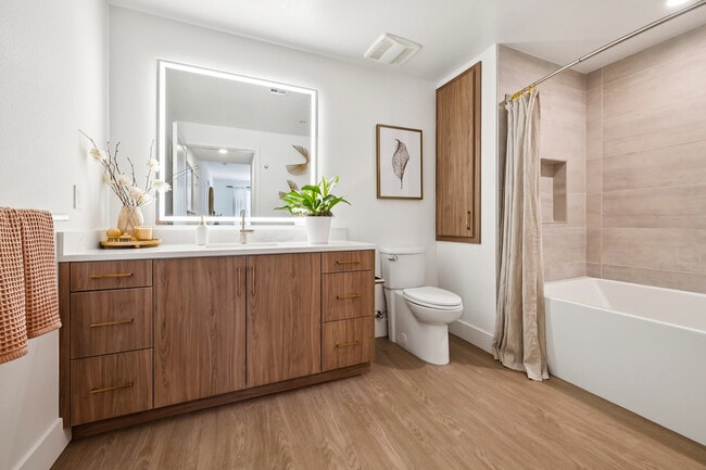 Beautiful bathroom with large tiled tub - AMLI Aero