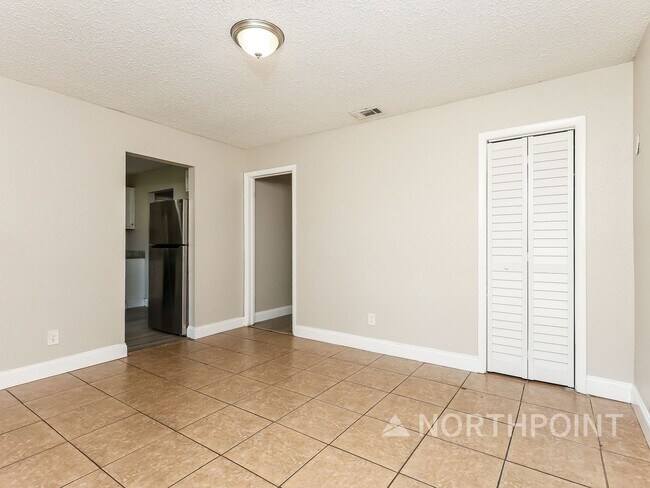 Photo - 3 BR/1BA | Newly Renovated Single Family Home | Screened in Patio and carpot | Huge backyard!