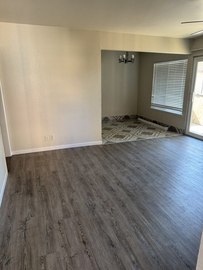 View of Living Area and Dining Area from Doorway Entry - 1550 W Ashlan Ave Unit 232
