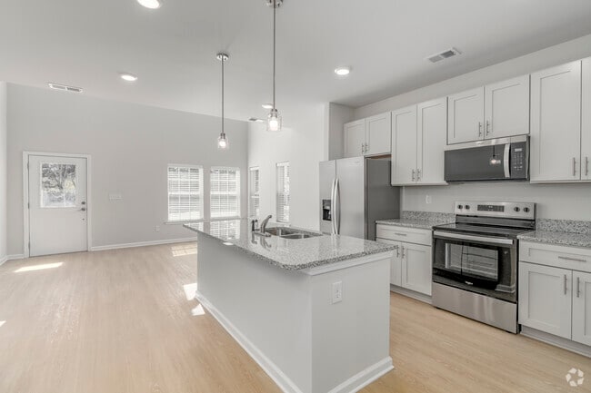 End Unit 3BR, 3BA - 1,600SF - Kitchen & Living Room