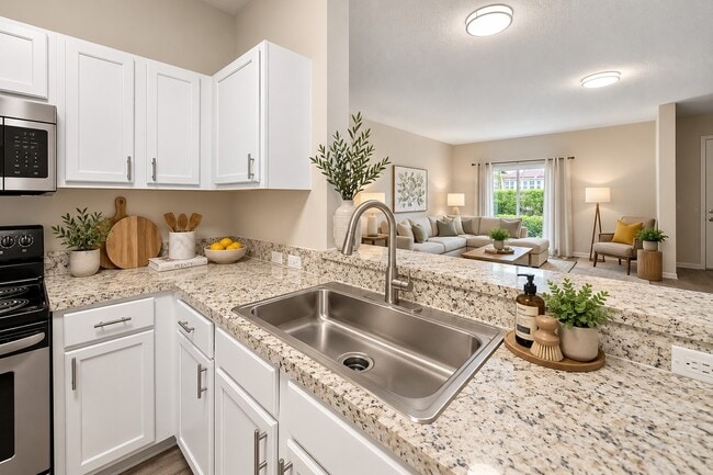 Elevate your lifestyle at Delray Bay with this beautifully designed kitchen featuring modern finishes and a spacious layout. Enjoy culinary delights in a bright, inviting space. Explore your future home today!