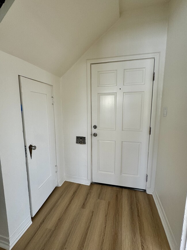 Entrance with closet on the left. - 1335 S Redondo Blvd Apartments Unit 2