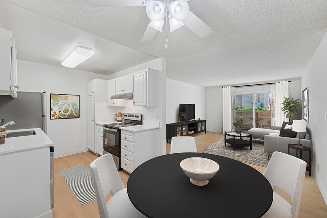 Renovated Package I kitchen, living, and dining area with hard surface flooring - eaves Foster City