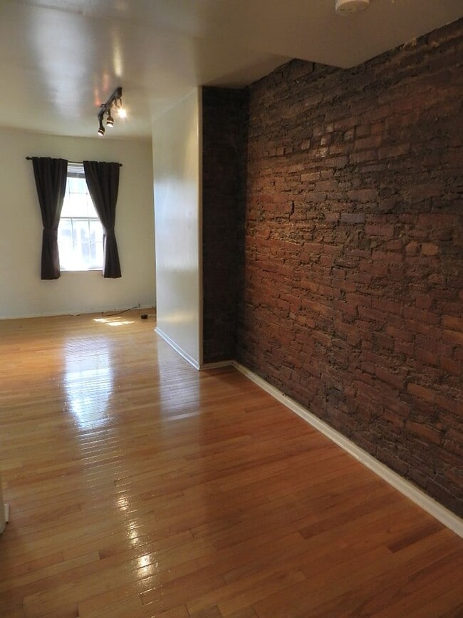 Photo - Spacious Bi-Level 2 Bedroom, 2 Bathroom with Exposed Brick & In-Unit Laundry Unit #2R