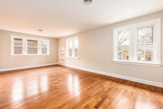 living room w/ built-in bookcase - 7136 Amherst Ave