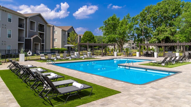 Ideal for both relaxation and social gatherings, our poolside amenities include grilling stations and ample seating. Enjoy a refreshing swim or unwind under the sun in this serene and inviting space, designed for ultimate comfort and enjoyment. - ONYX Apartments