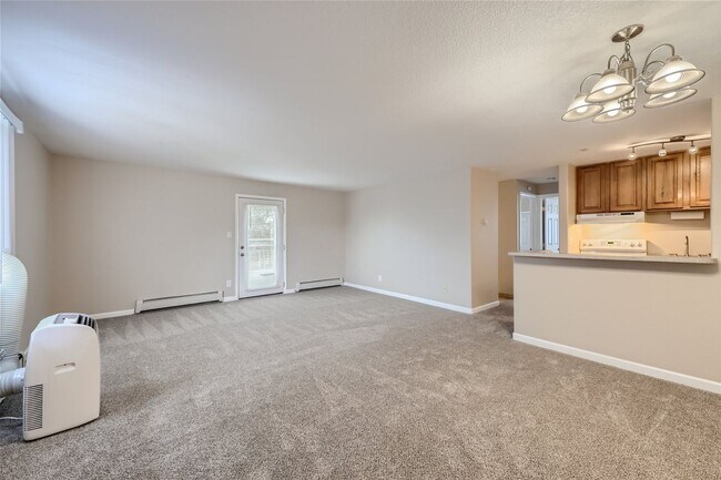 Photo - Top-floor, 2-bed 1-bath condo located near the highly desirable Old Town Arvada! Unit 301