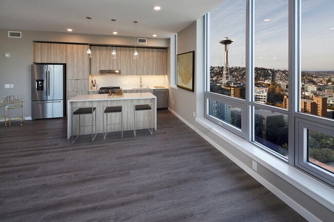 Signature Collection penthouse kitchen and dining area with hard surface flooring.