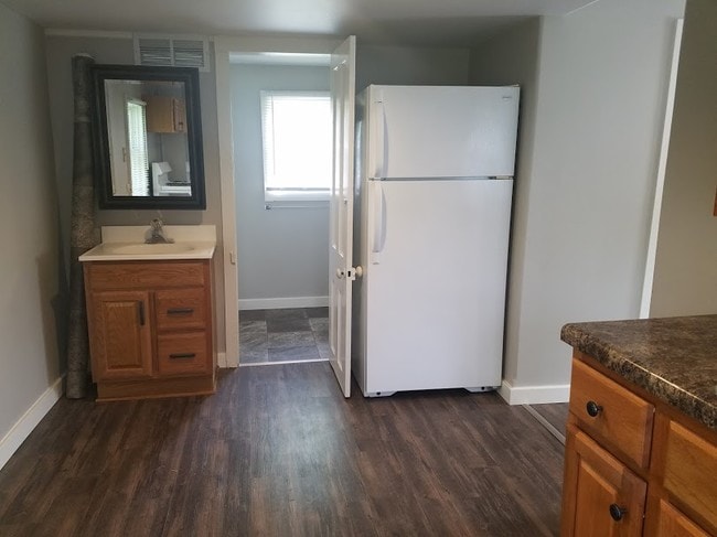 Kitchen includes refrigerator - 103 12th W St Unit 3