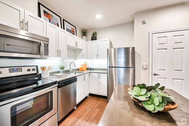 Renovated kitchens with stainless steel appliances - Reflections by Windsor Rental