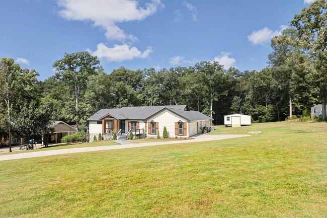 Photo - COMING SOON · Designer Renovation · Covered Deck Pavilion · 2-Car Garage · Lawn Care Included