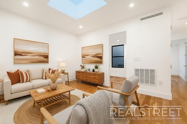 Photo - Modern Renovated 2BR with Skylight & Private Balcony in Prime Crown Heights