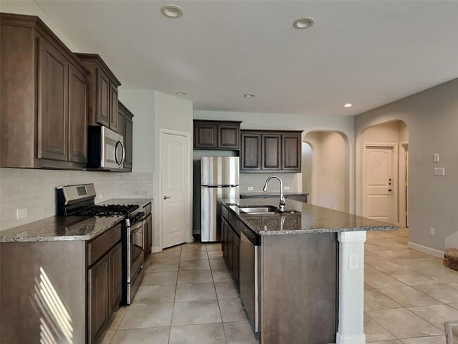Photo - 5BR/4BA | Updated Single Family Home | 2-Car Garage | Gated backyard