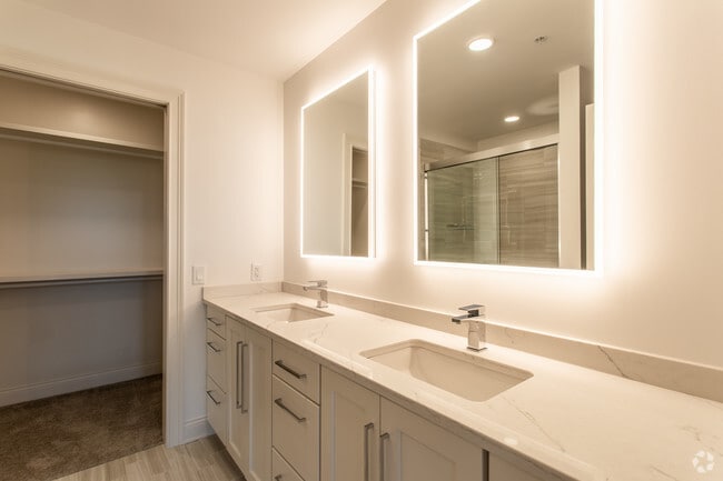 Master Bathroom with double vanities and custom built walk in closets