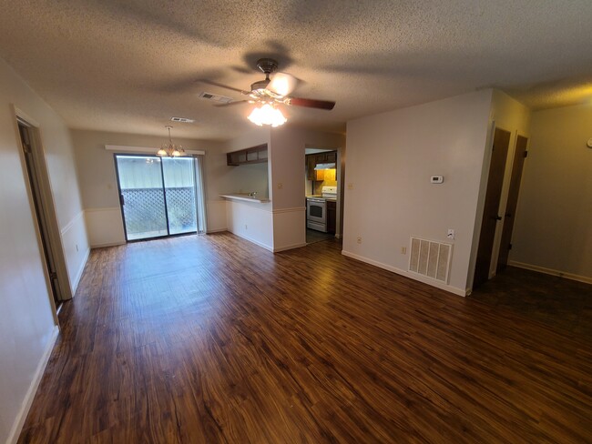 Open floor plan living room and dining area! - 1748 Port Dr Apartments