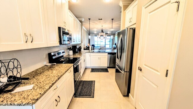 Photo - Seasonal/short term turnkey furnished Incredible 2/2 with den ground floor condo in resort Esplan...