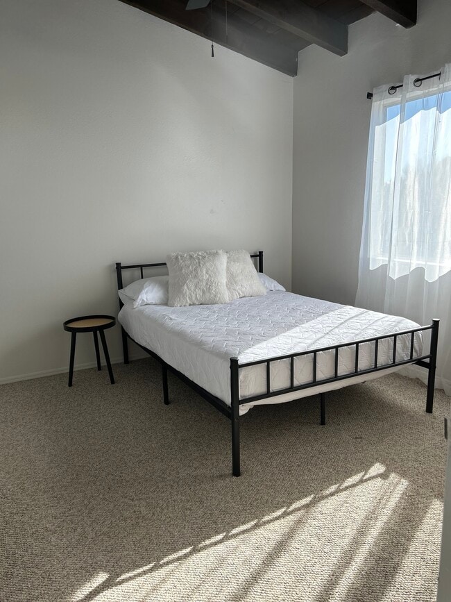 Front bedroom with Full Size bed and large closet space - 440 N Dodge Blvd